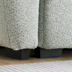 Canapé d'angle en tissu bouclé avec pouf mobile