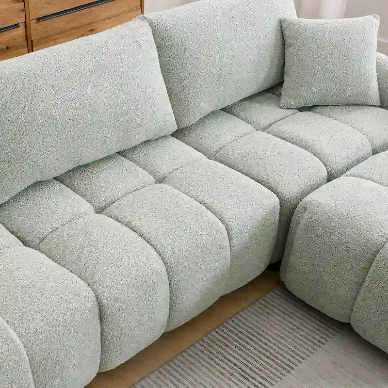 Canapé d'angle en tissu bouclé avec pouf mobile